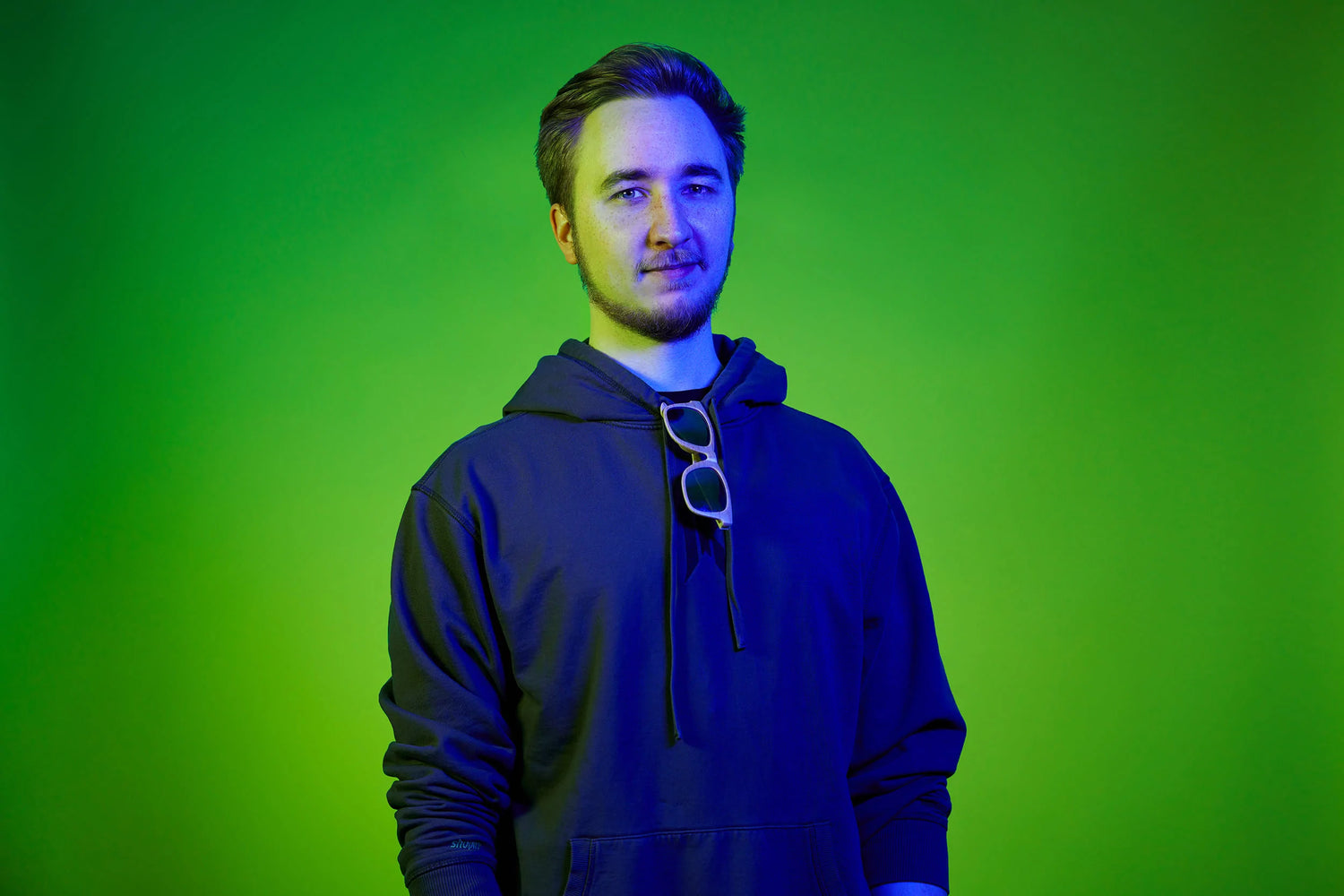 Player (Lambo) with a Rebellion hoodie and a green background