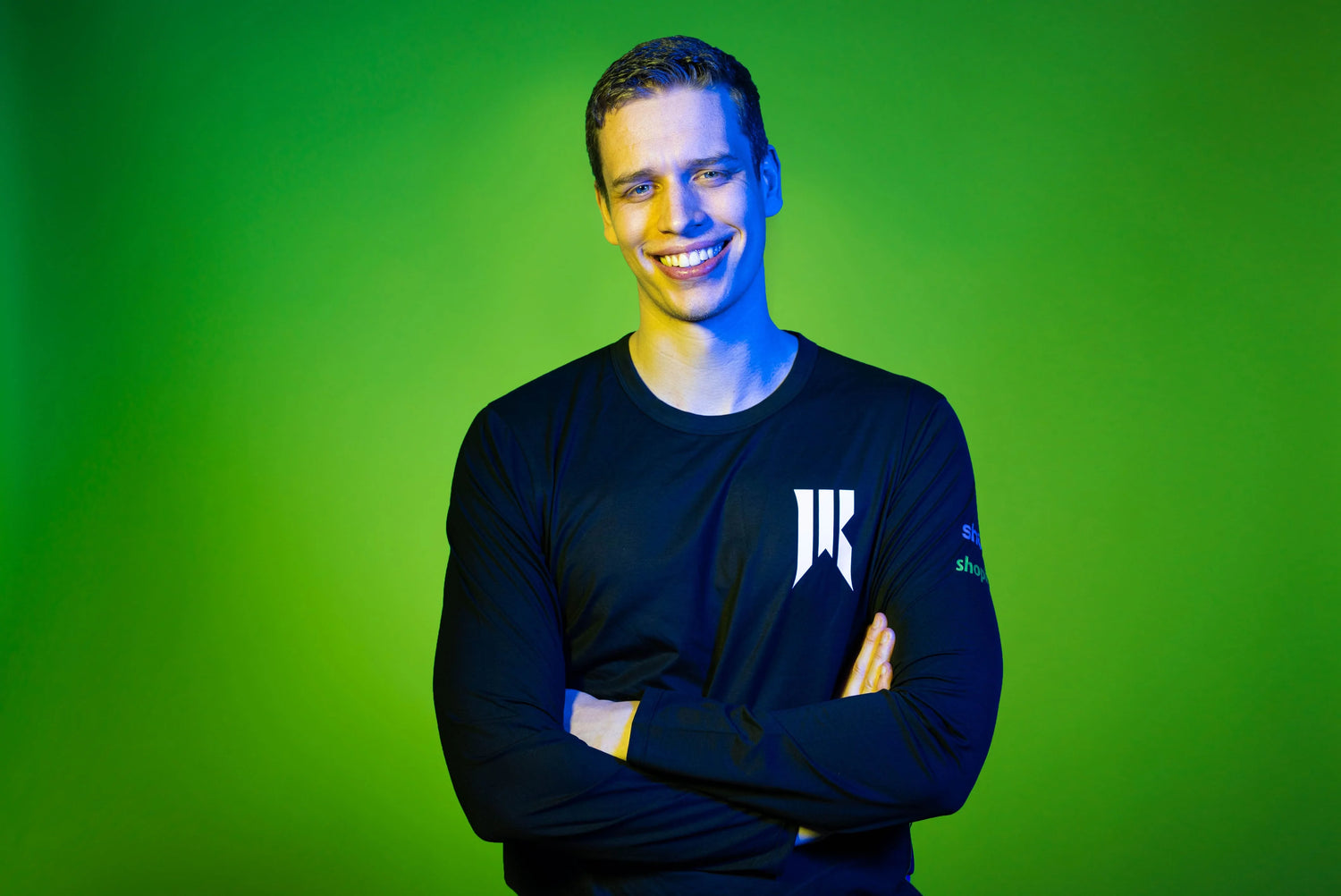 Player (Harstem) with a Rebellion shirt and a green background